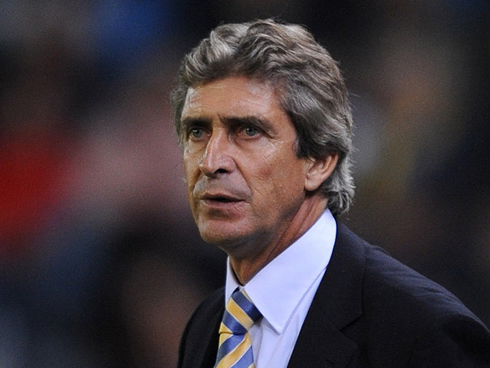 Manuel Pellegrini all dressed up with a suit and a tie, during a match in the Spanish League