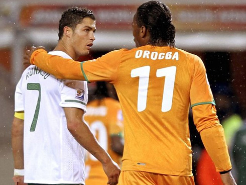 Cristiano Ronaldo and Didier Drogba showing they are good friends