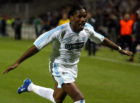 Didier Drogba goal celebration in a Marseille white jersey, in 2003-2004