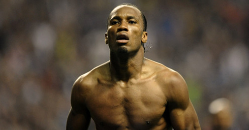 Didier Drogba half naked, showing his flat chest muscles for a black man, and large shoulders in 2012-2013