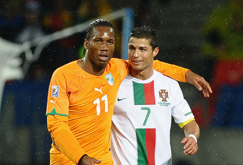 Didier Drogba putting his arm around Ronaldo, during a game for the World Cup 2010