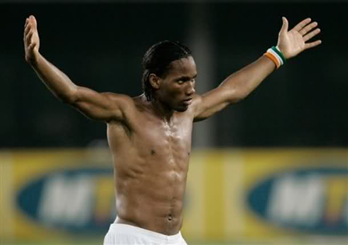 Didier Drogba shirtless showing his abs and muscles definition