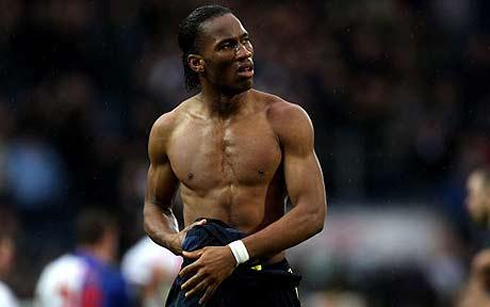 Didier Drogba with no shirt, showing his ripped body and black guy muscles