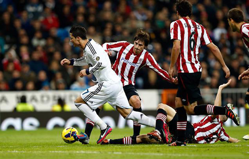 Cristiano Ronaldo dribbling 3 defenders and being tackled from behind, in Real Madrid 2012-2013