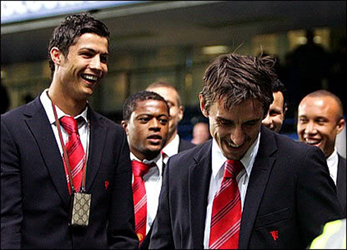 Cristiano Ronaldo smiling with Gary Neville, when both were traveling with Manchester United