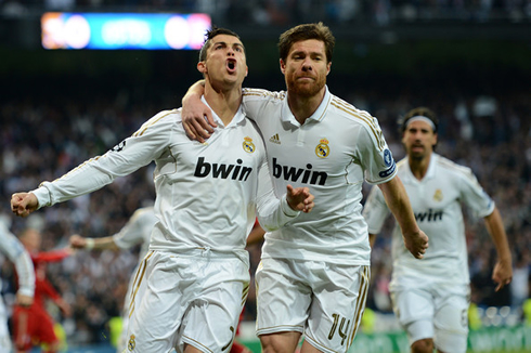Cristiano Ronaldo and Xabi Alonso celebrating Real Madrid goal