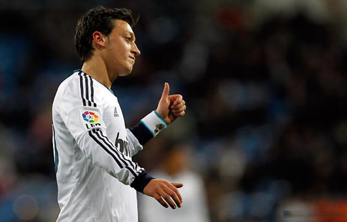 Mesut Ozil making an hand gesture to a colleague, in Real Madrid vs Alcoyano, for the Copa del Rey in 2012-2013