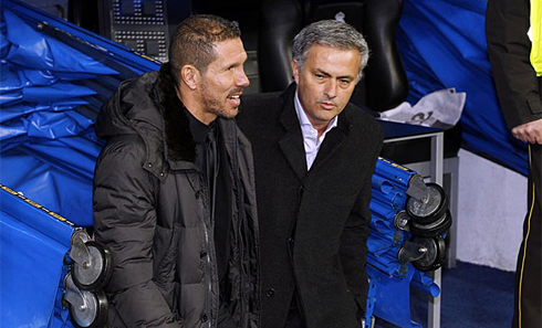 José Mourinho and Diego Simeone stepping up to the pitch together as friends, in Real Madrid vs Atletico Madrid, in 2012-2013