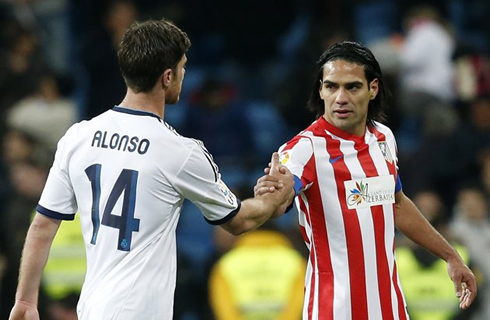 Xabi Alonso and Radamel Falcao saluting each other, in Real Madrid vs Atletico Madrid, for La Liga 2012-2013
