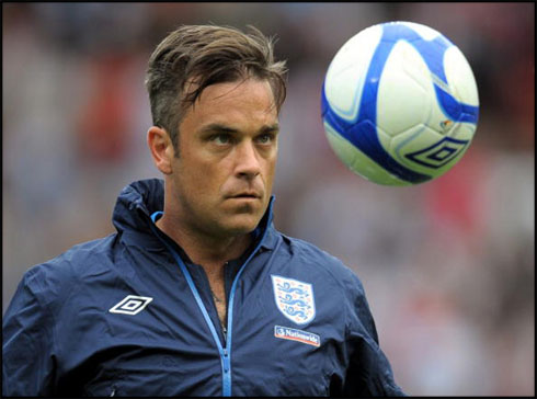 Robbie Williams playing football in England, at the Wembley stadium