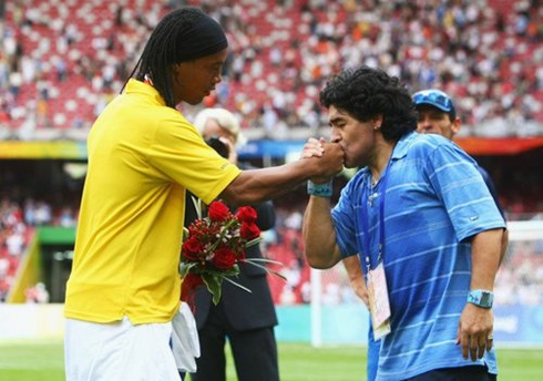 Diego Armando Maradona kissing Ronaldinho hand