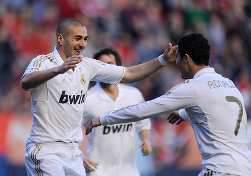 Karim Benzema about to jump into Cristiano Ronaldo's lap