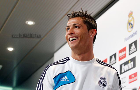 Cristiano Ronaldo preparing to leave the room, with a big smile on his face