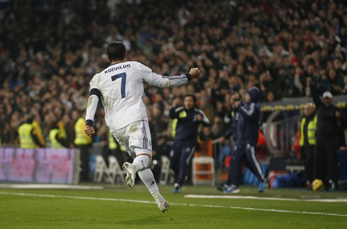 Cristiano Ronaldo running around the pitch to meet Real Madrid coaching staff in the bench