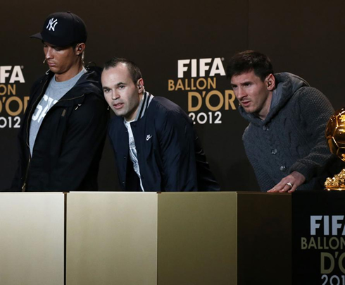 Cristiano Ronaldo, Andrés Iniesta and Lionel Messi, preparing to take their seats at the FIFA Balon d'Or 2012 press conference