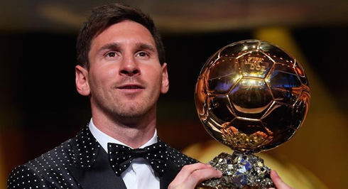 Lionel Messi showing off his 4th FIFA Balon d'Or 2012 award