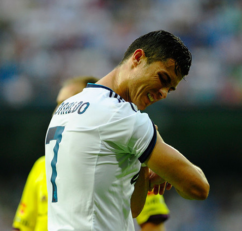 Cristiano Ronaldo showing off his triceps arm muscle, in Real Madrid 2013