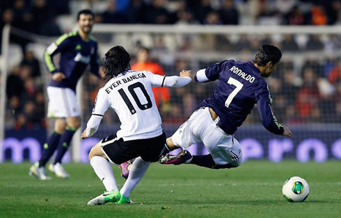 Cristiano Ronaldo being tackled by Ever Banega, in Valencia vs Real Madrid, in 2013