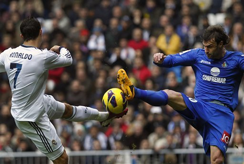 Cristiano Ronaldo left foot shot being denied by a defender