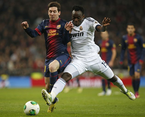 Michael Essien charging and pushing Lionel Messi, in Real Madrid 1-1 Barcelona, for the Copa del Rey 2013