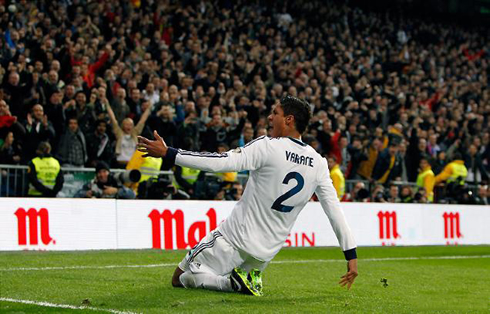 Raphael Varane sliding on his knees to celebrate his team equaliser in Real Madrid vs Barcelona, in Copa del Rey 2013