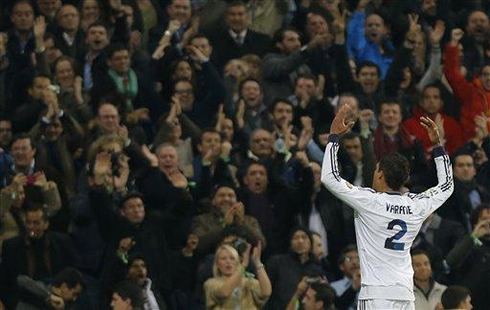 Raphael Varane waving and celebrating in front of the Santiago Bernabéu fans, after scoring in Real Madrid 1-1 Barça, in 2013