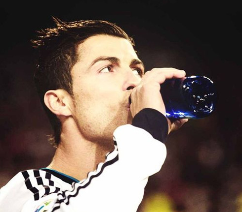 Cristiano Ronaldo drinking water during a game for Real Madrid, in 2013