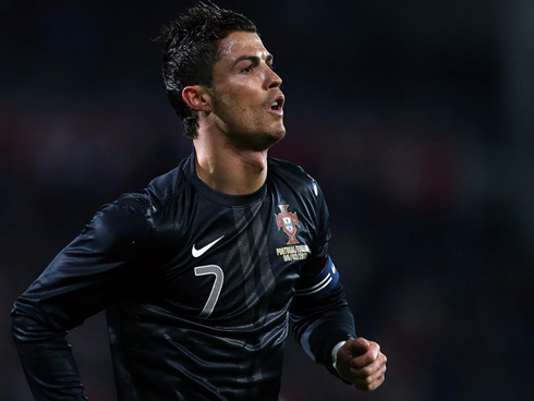 Cristiano Ronaldo playing for Portugal and wearing the new black kit and jersey, in 2013