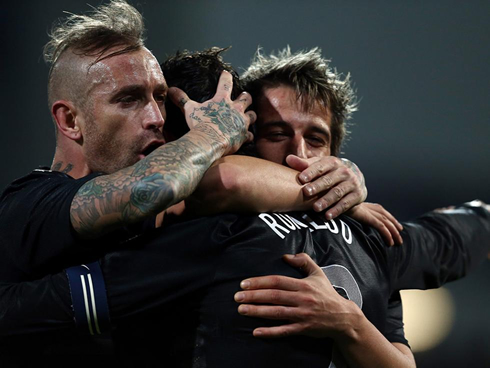 Raúl Meireles and Fábio Coentrão celebrating goal with Cristiano Ronaldo, in 2013