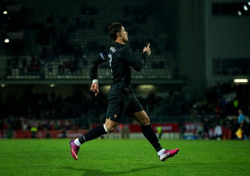 Cristiano Ronaldo running around the pitch in Guimarães, after scoring for Portugal against Ecuador, in a friendly match in 2013