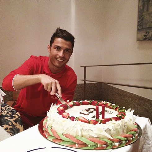 Cristiano Ronaldo cutting his 28th birthday cake in 2013