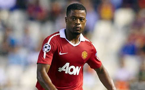 Patrice Evra playing for Manchester United, in 2013