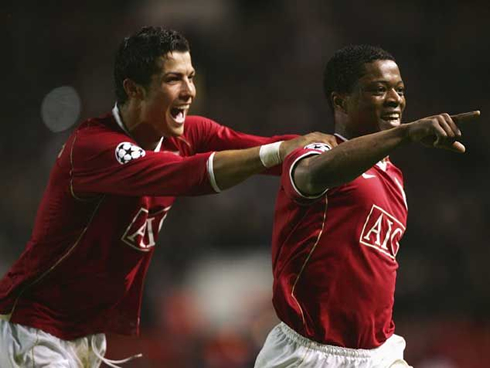 Cristiano Ronaldo running after Patrice Evra, after a Manchester United goal