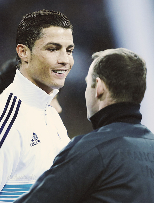 Cristiano Ronaldo smiling and greeting Wayne Rooney, in Real Madrid vs Manchester United, for the UCL in 2013