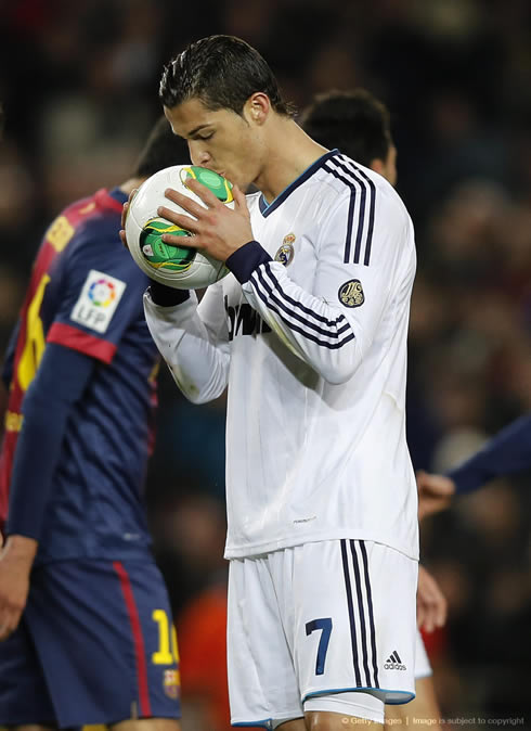 Cristiano Ronaldo kissing the ball before taking the penalty kick against Barcelona, in February 2013