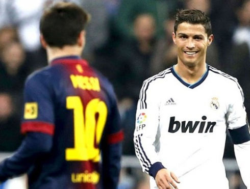 Cristiano Ronaldo smiling near Lionel Messi in Real Madrid vs Barcelona, in 2013
