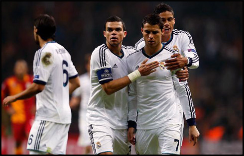 Cristiano Ronaldo carrying Real Madrid on his shoulders, with Pepe and Varane climbing to his back, in 2013