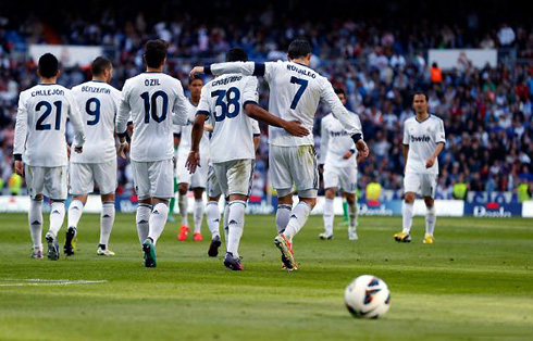 Cristiano Ronaldo putting his arm over Casemiro on his debut for Real Madrid, as both celebrate a goal against Betis, in La Liga 2013