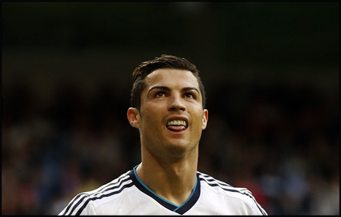 Cristiano Ronaldo putting on a funny and childish face with his tongue out, in Real Madrid 2013