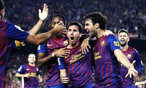 Barcelona players Lionel Messi and Cesc Fabregas, showing their joy after scoring a goal at the Camp Nou