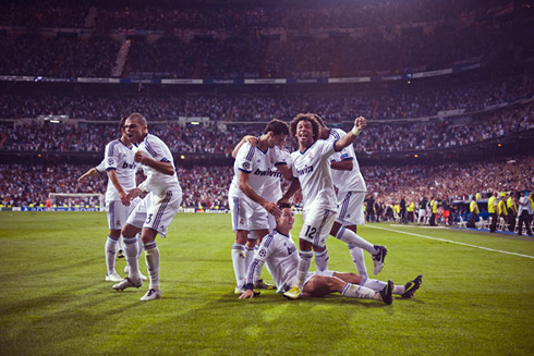 Cristiano Ronaldo celebrating a goal with Real Madrid players, in 2013