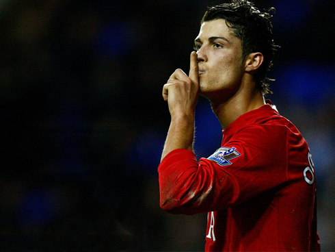Cristiano Ronaldo doing the silence gesture in a goal celebration, while a Manchester United player in 2008-2009