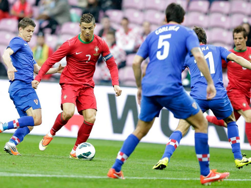 Cristiano Ronaldo in the middle of three defenders, in Croatia vs Portugal