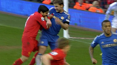 Luis Suárez biting Branislav Ivanović, in Liverpool vs Chelsea in 2013