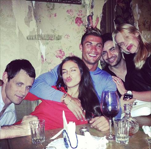 Cristiano Ronaldo holding Irina Shayk with friends by their side, on a dinner in New York
