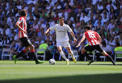 Cristiano Ronaldo preparing to dribble two defenders in Real Madrid vs Athletic Bilbao