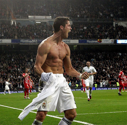 Cristiano Ronaldo showing off his beast physique and six pack abs, in Real Madrid