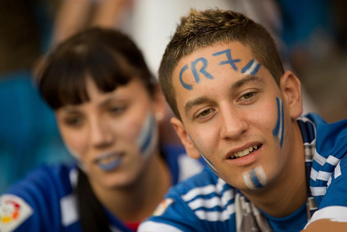 Cristiano Ronaldo fan, with CR7 name painted on his forehead