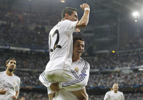 Cristiano Ronaldo raising Angel Di María in the air