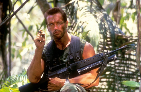 Arnold Schwarzenegger smoking between predator scenes